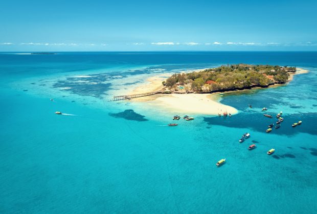 Aerial view of Prison Island, Zanzibar, Tanzania, near Stone Town, with surrounding beach and boats. Toned image.